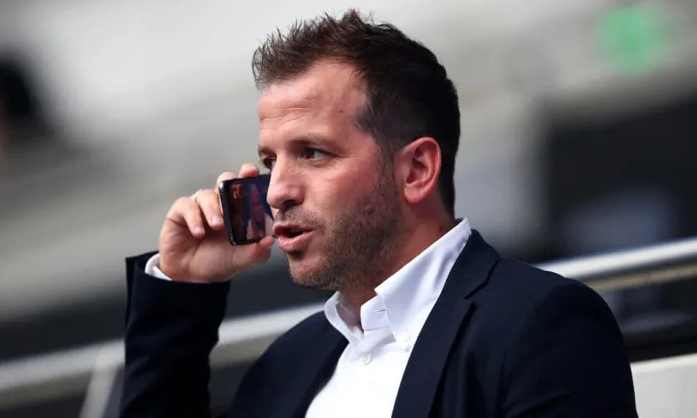 Man talking on the phone in a stadium Man talking on the phone in a stadium