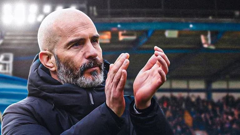 Coach applauding during a match at the stadium Coach applauding during a match at the stadium