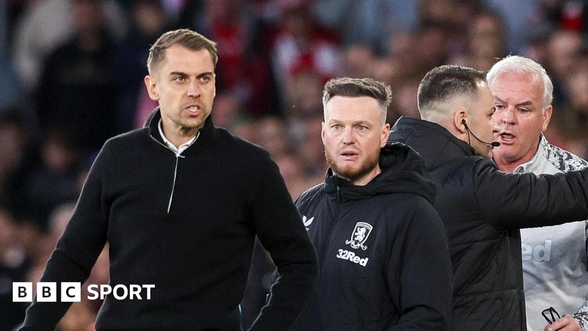 Coaches interacting on the sidelines during match Coaches interacting on the sidelines during match