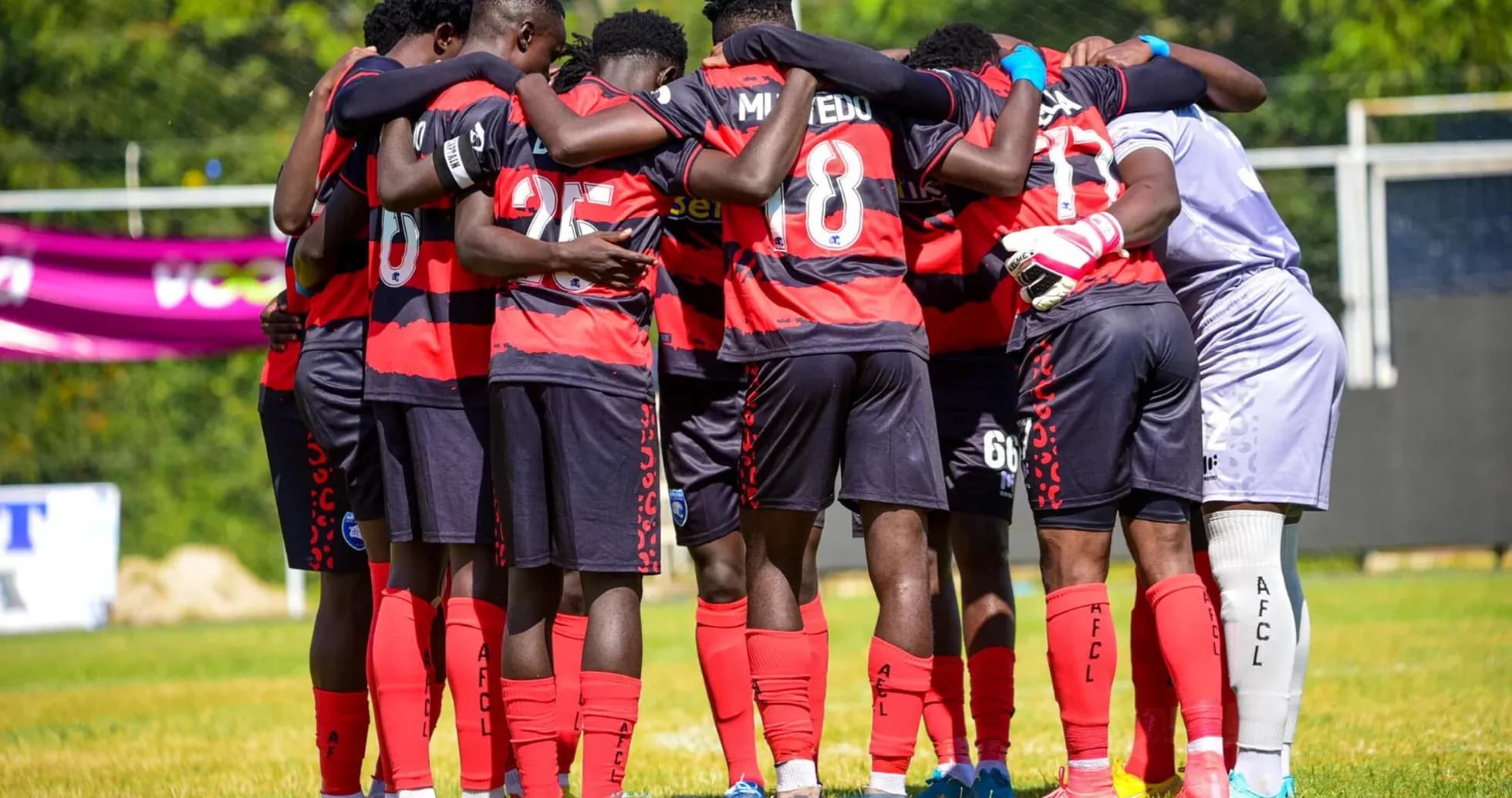 AFCL players huddling before the match AFCL players huddling before the match