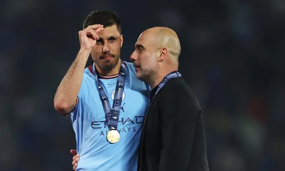 Player and manager celebrating victory with medals Player and manager celebrating victory with medals