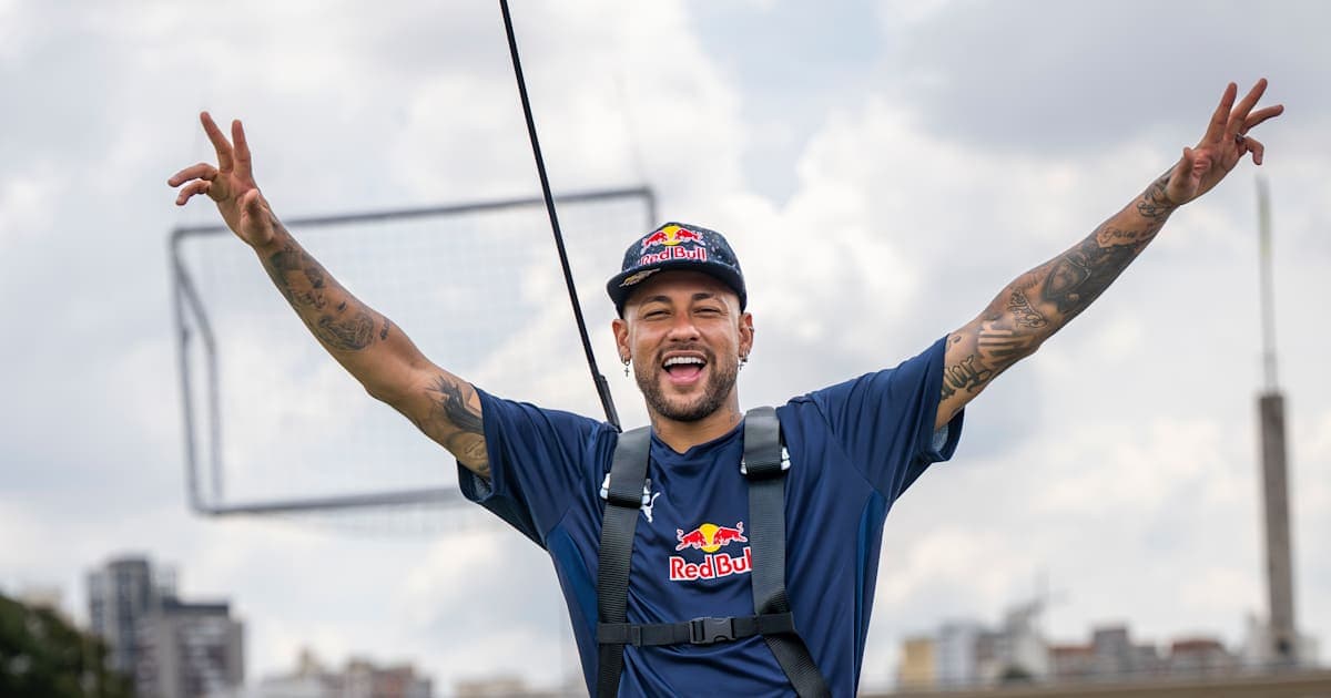 Neymar celebrating with arms raised outdoors Neymar celebrating with arms raised outdoors