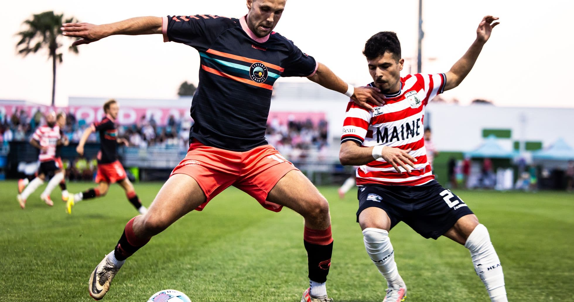 Players competing for the ball during USL match Players competing for the ball during USL match