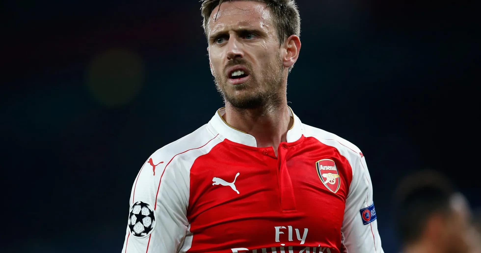 Player in Arsenal jersey during match action Player in Arsenal jersey during match action