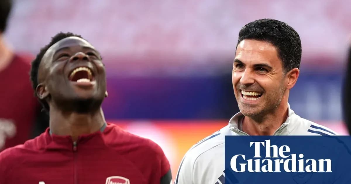 Two Arsenal team members smiling during warm-up Two Arsenal team members smiling during warm-up