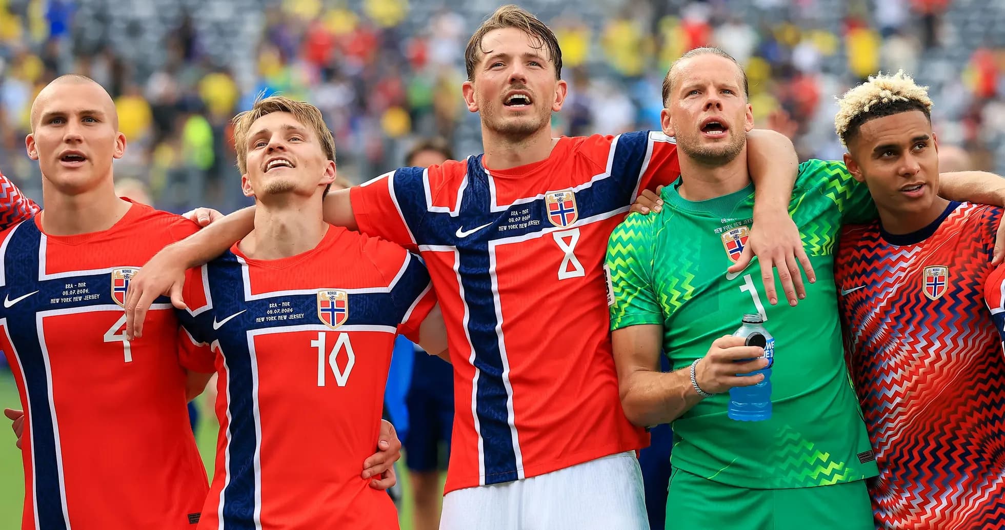 Norwegian football players celebrating together after match Norwegian football players celebrating together after match