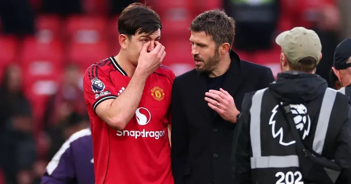 Manchester United player and coach discussing after match Manchester United player and coach discussing after match