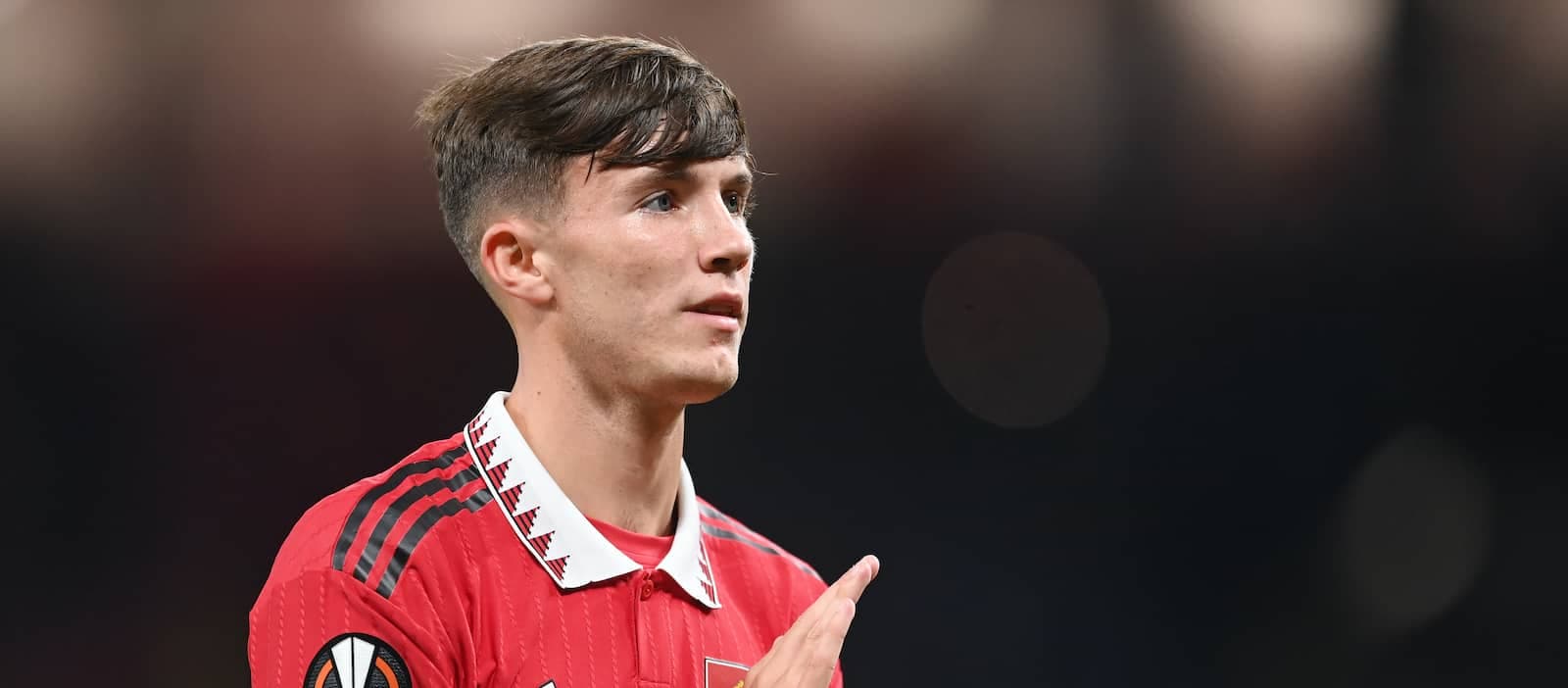 Player in red jersey gesturing during match Player in red jersey gesturing during match