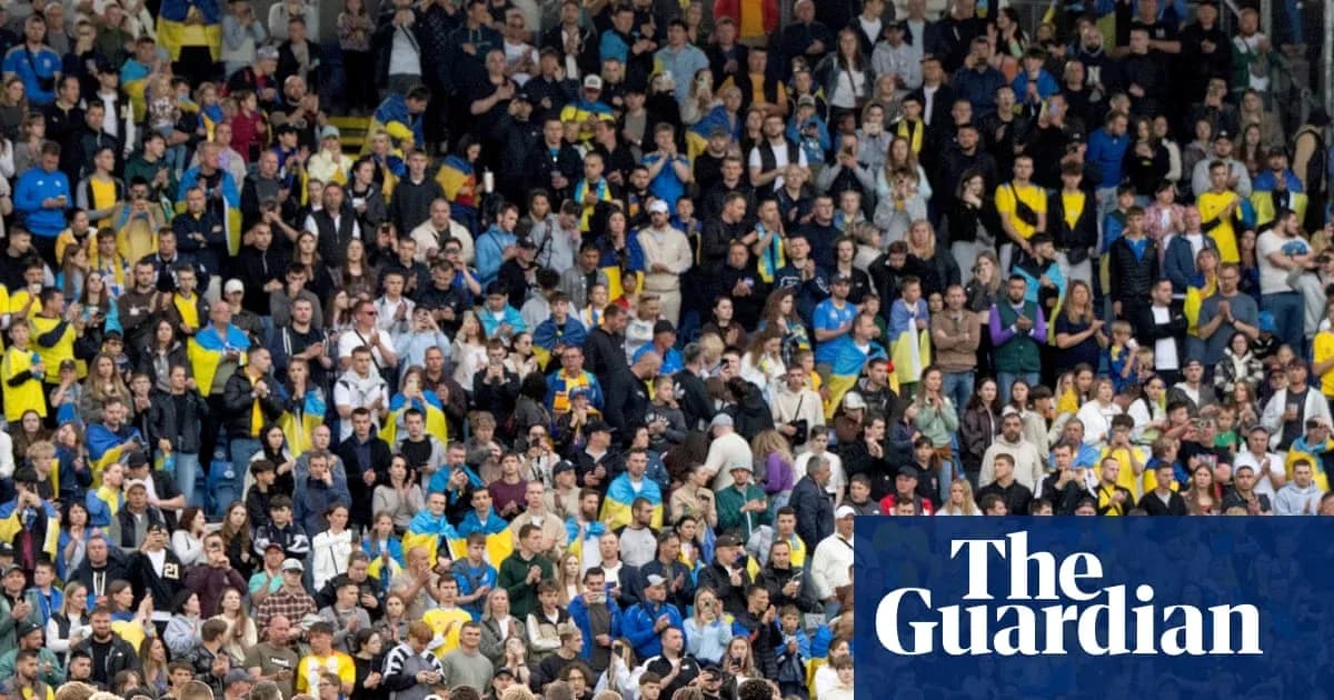 Crowd of fans cheering at a sports event Crowd of fans cheering at a sports event