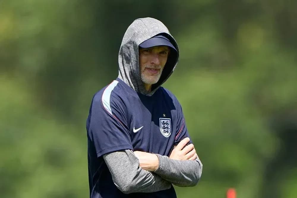 Coach wearing hoodie during training session Coach wearing hoodie during training session