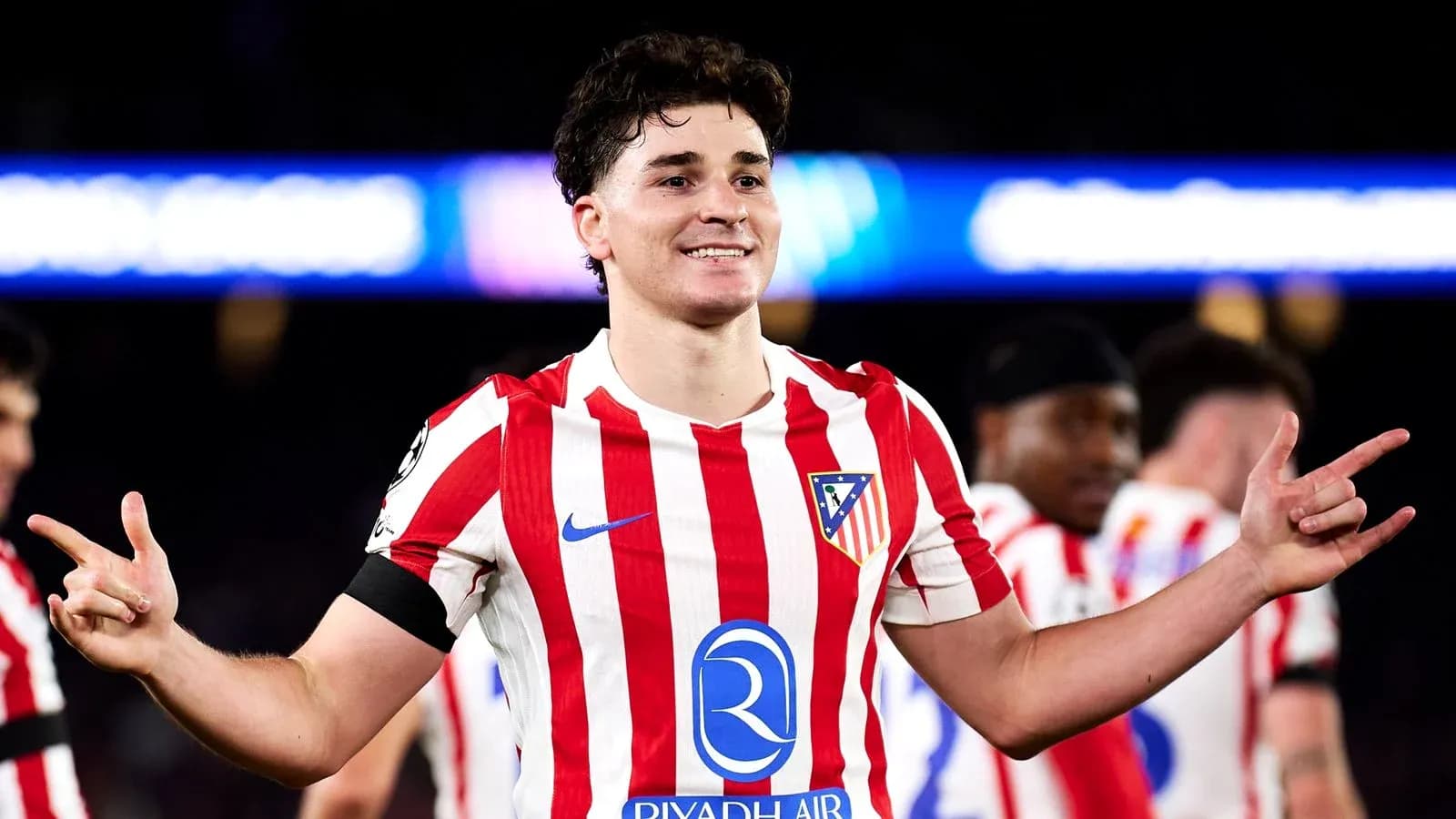 Atletico Madrid player celebrating with teammates Atletico Madrid player celebrating with teammates