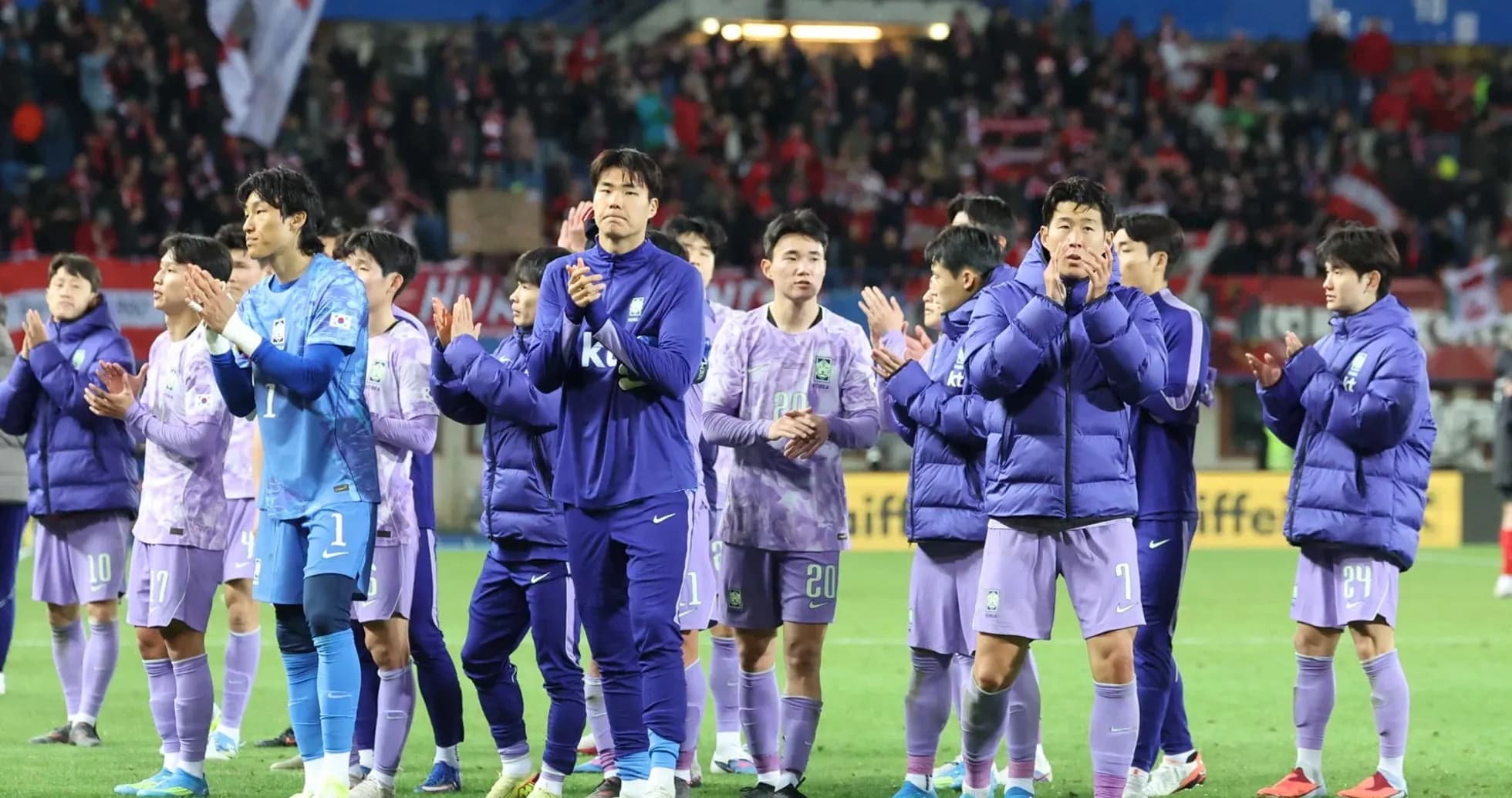 Team applauding fans after match in stadium Team applauding fans after match in stadium