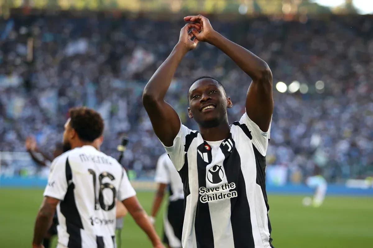 Player celebrating with fans during a match Player celebrating with fans during a match