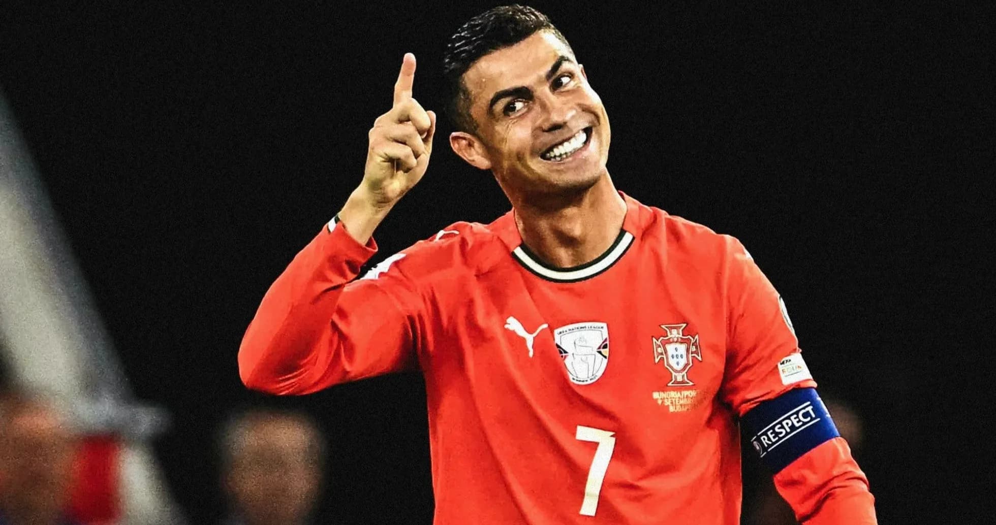 Player celebrating with finger raised in red jersey Player celebrating with finger raised in red jersey