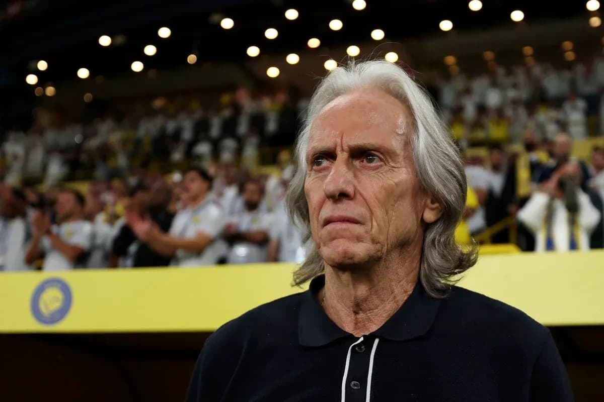 Coach observing match with fans applauding in background Coach observing match with fans applauding in background