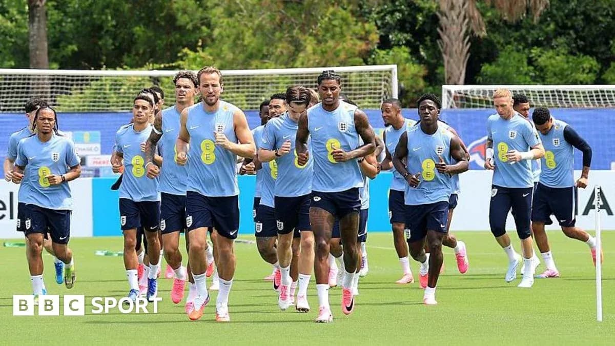 England team jogging during training session on pitch England team jogging during training session on pitch