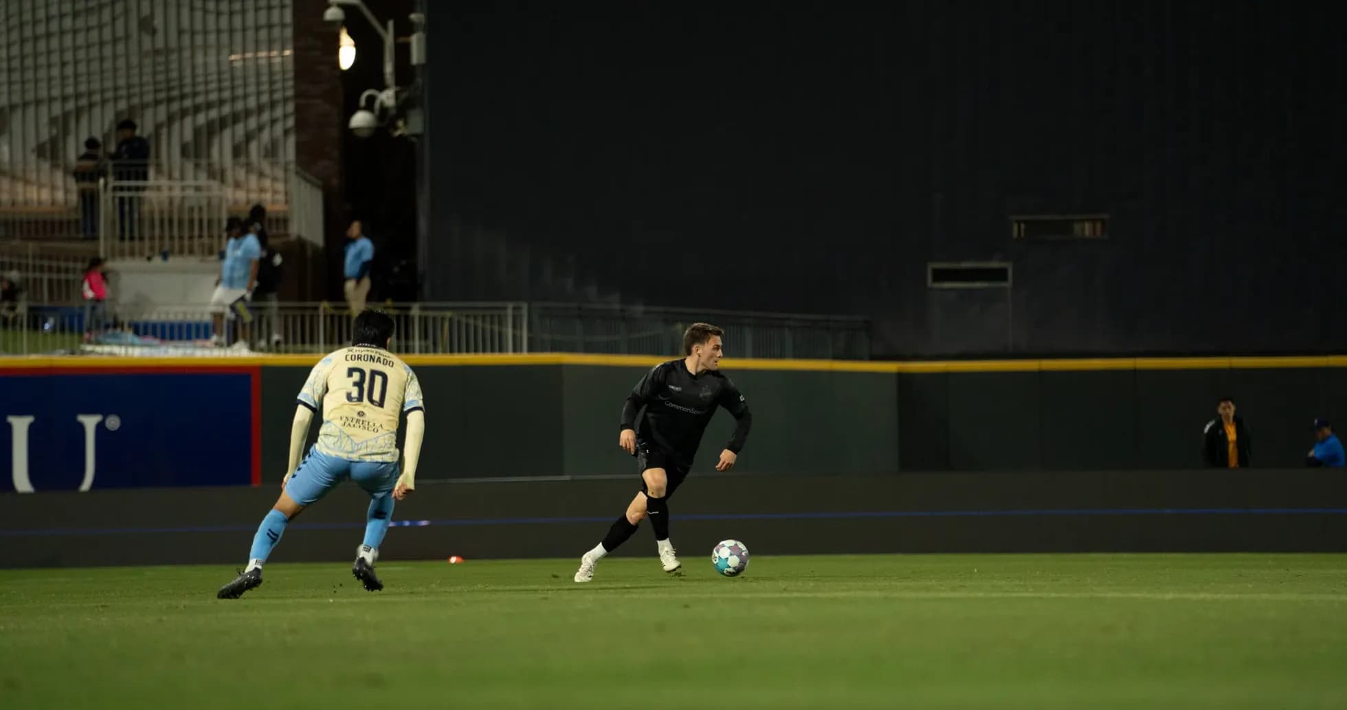 Player dribbling the ball during match Player dribbling the ball during match