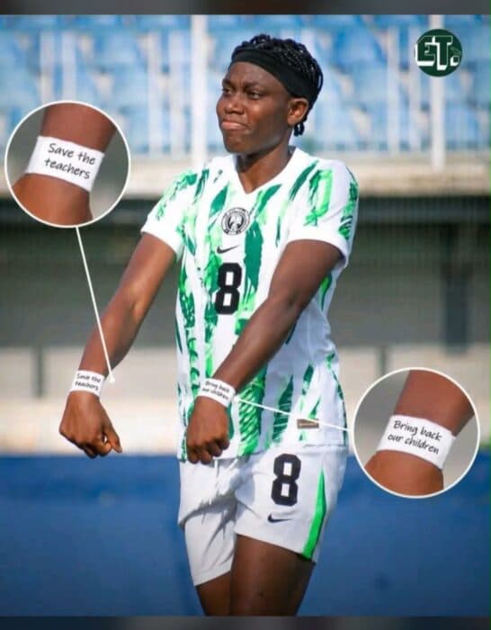 Player wearing Nigeria jersey with protest messages on arms Player wearing Nigeria jersey with protest messages on arms