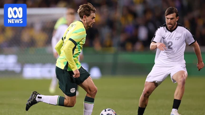 Player dribbling past opponent during football match Player dribbling past opponent during football match