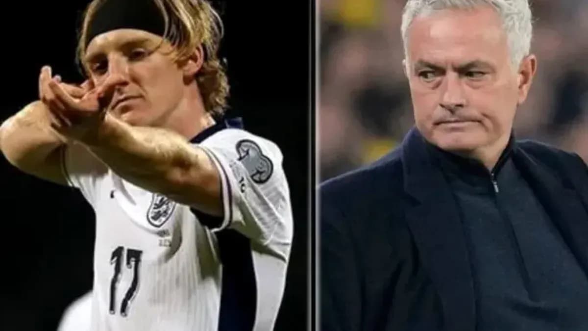 Football player celebrating alongside a coach Football player celebrating alongside a coach