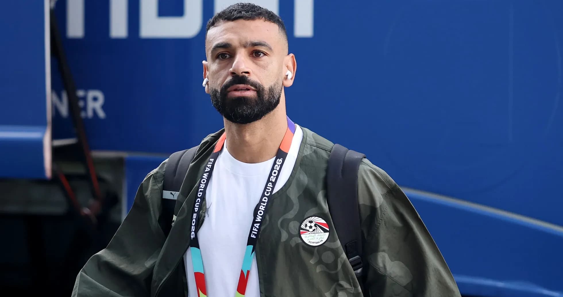 Player arriving at venue with headphones and bag Player arriving at venue with headphones and bag