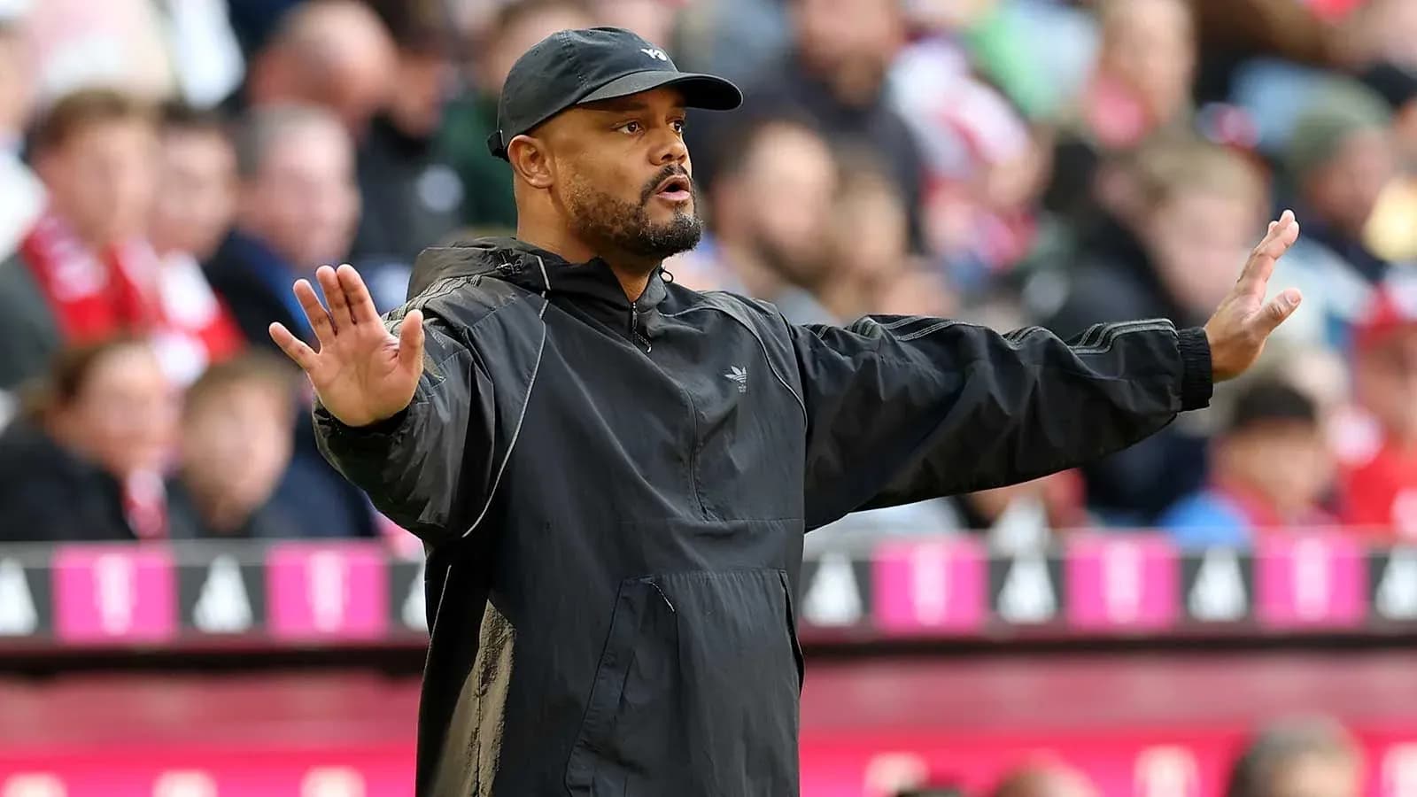 Coach gesturing to players during a match Coach gesturing to players during a match