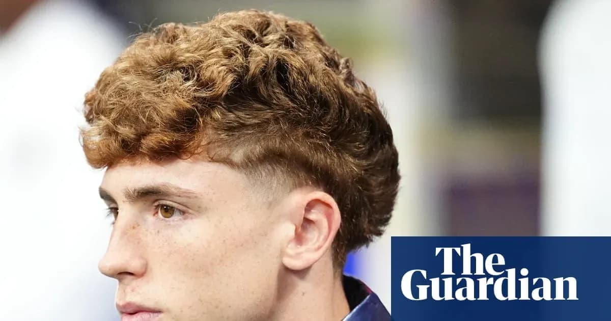 Young man with curly hair in profile view Young man with curly hair in profile view