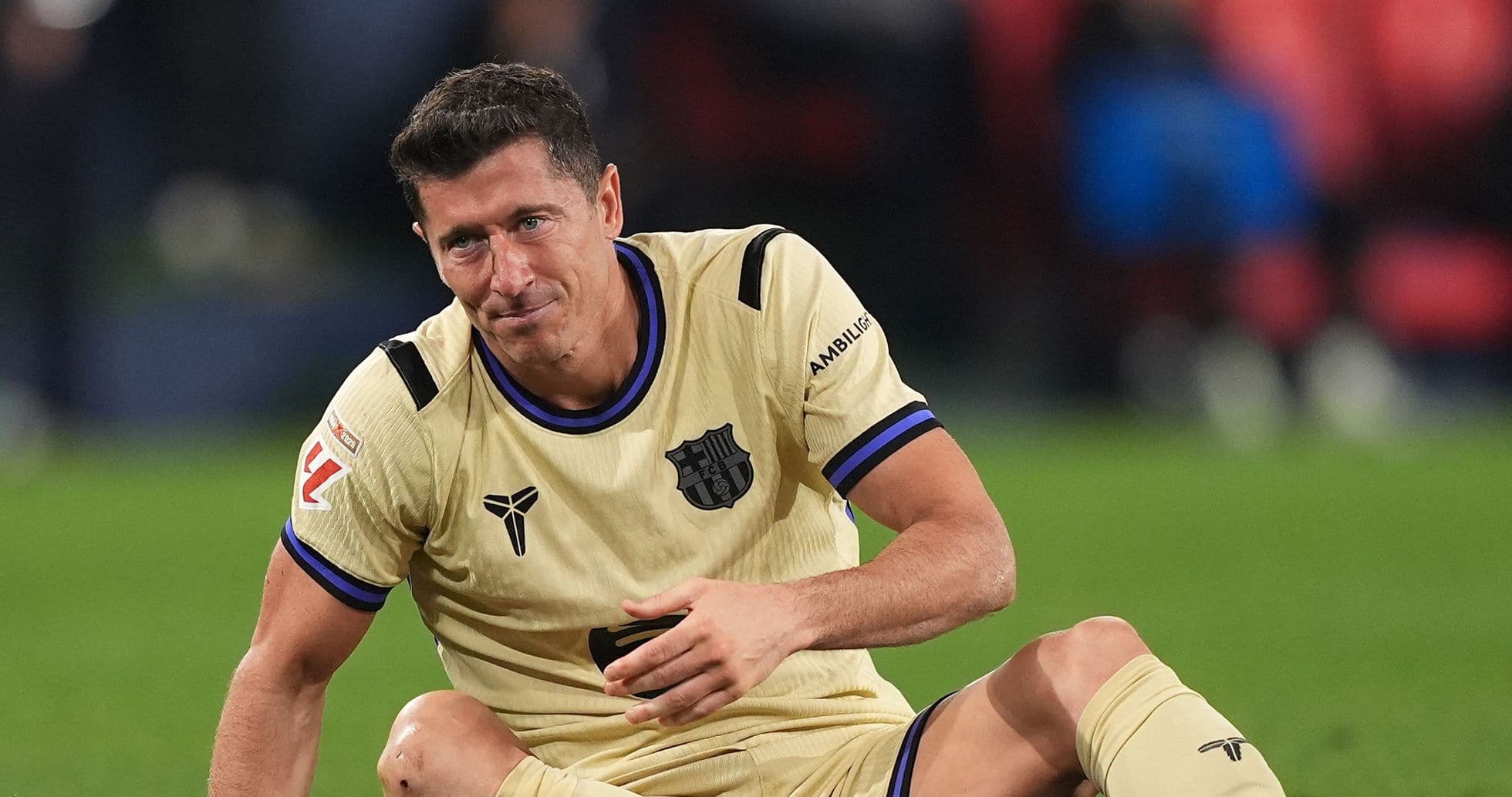 Player sitting on field after a play Player sitting on field after a play