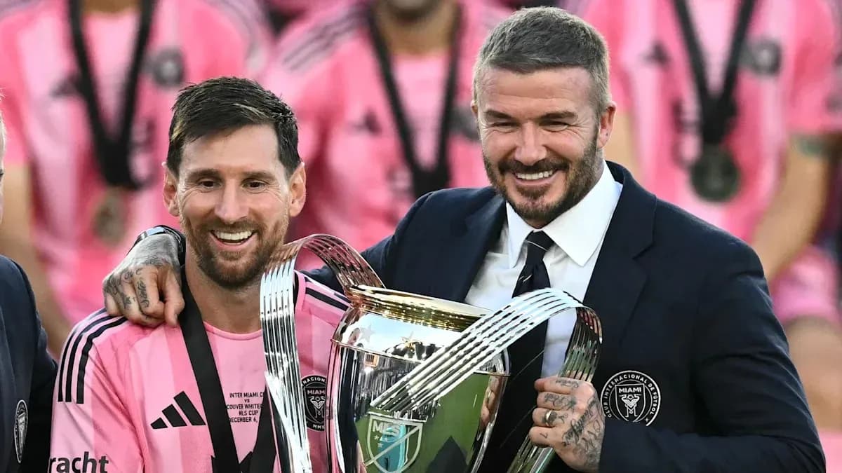 Lionel Messi and David Beckham with trophy Lionel Messi and David Beckham with trophy