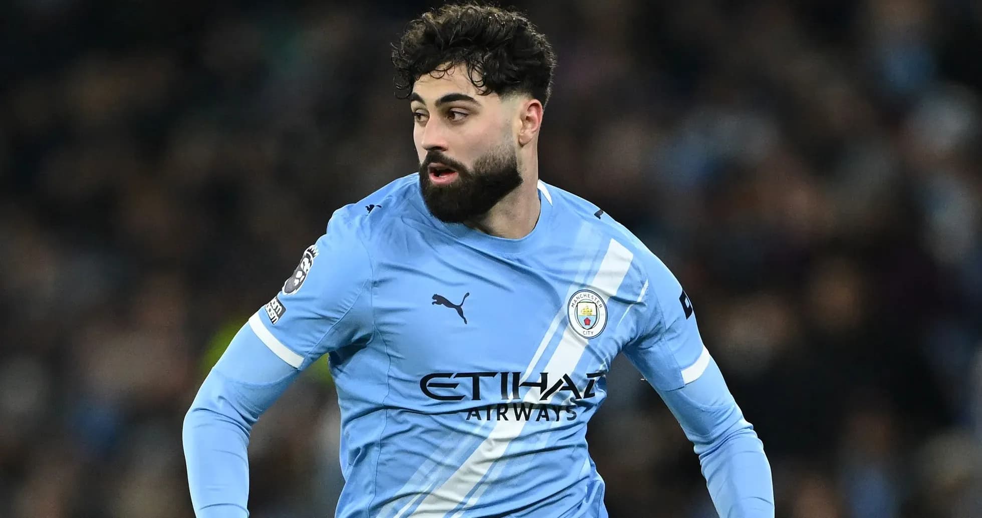 Player in Manchester City kit during match action Player in Manchester City kit during match action