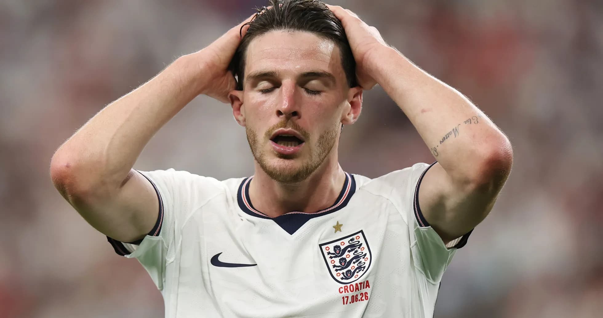 Player holding head in frustration during match Player holding head in frustration during match