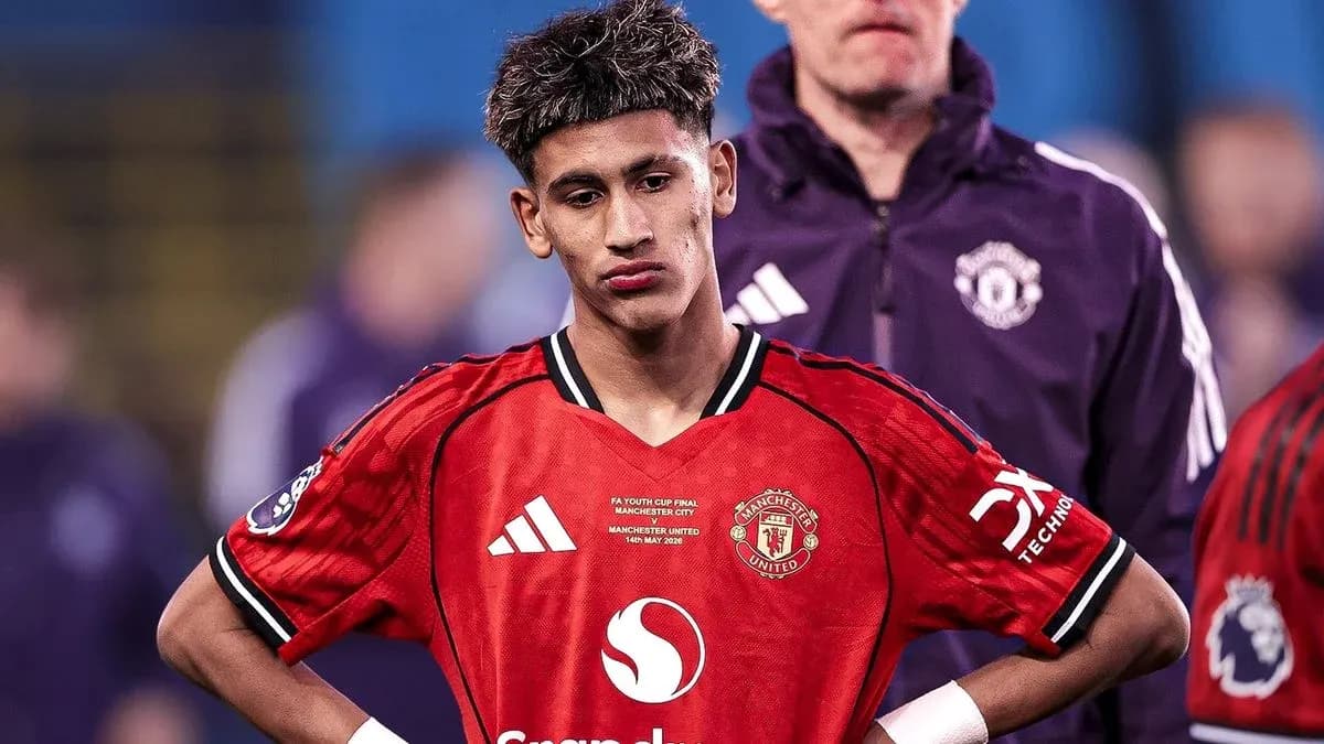 Young player in Manchester United jersey after match Young player in Manchester United jersey after match