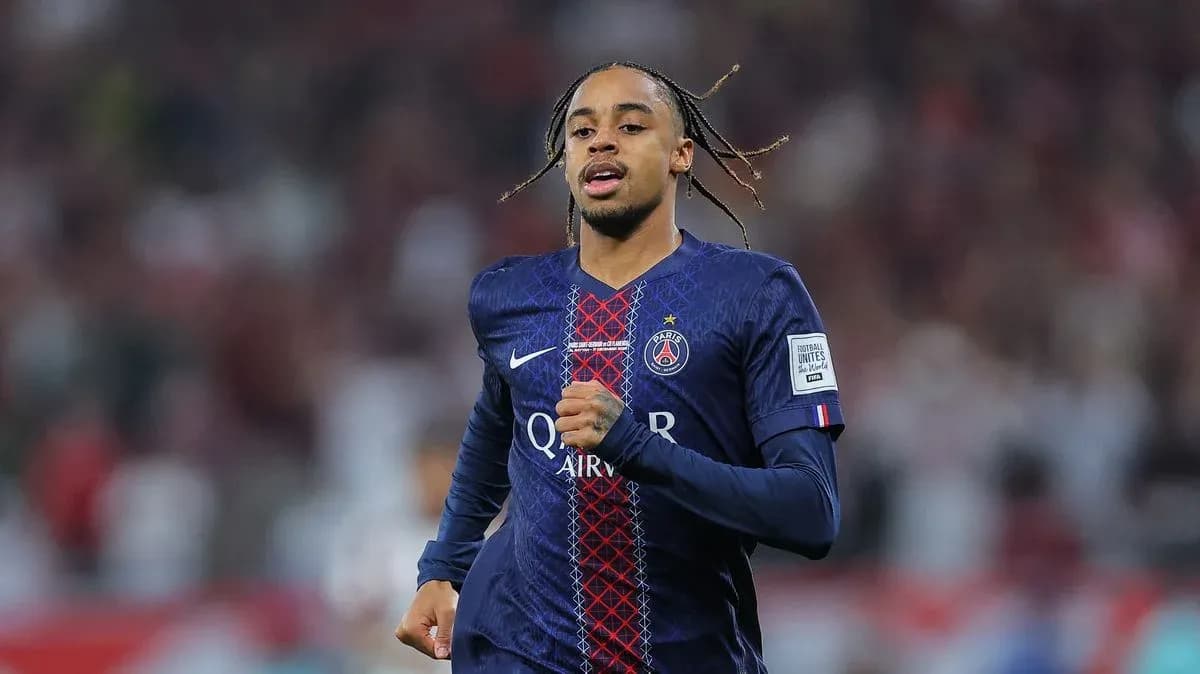 Player running in Paris Saint-Germain jersey on field Player running in Paris Saint-Germain jersey on field
