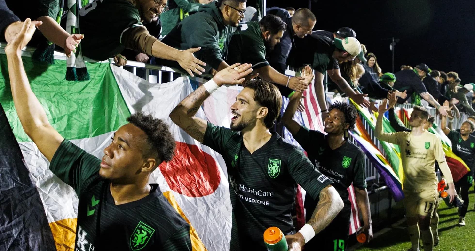 Lexington players celebrating with fans after match Lexington players celebrating with fans after match