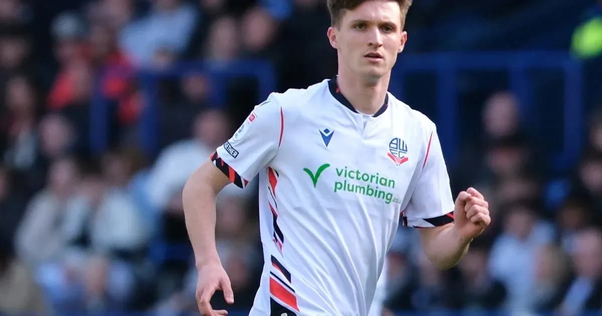 Bolton player running on the pitch during match Bolton player running on the pitch during match