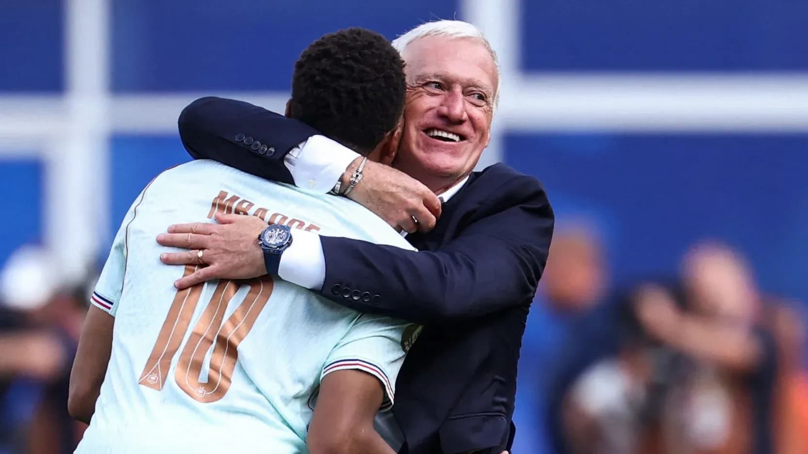 Player and coach embracing after match celebration Player and coach embracing after match celebration