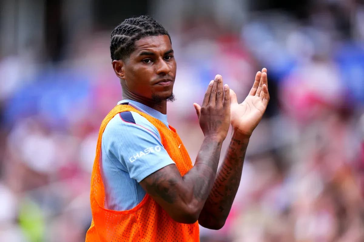 Player clapping while wearing training bib on field Player clapping while wearing training bib on field