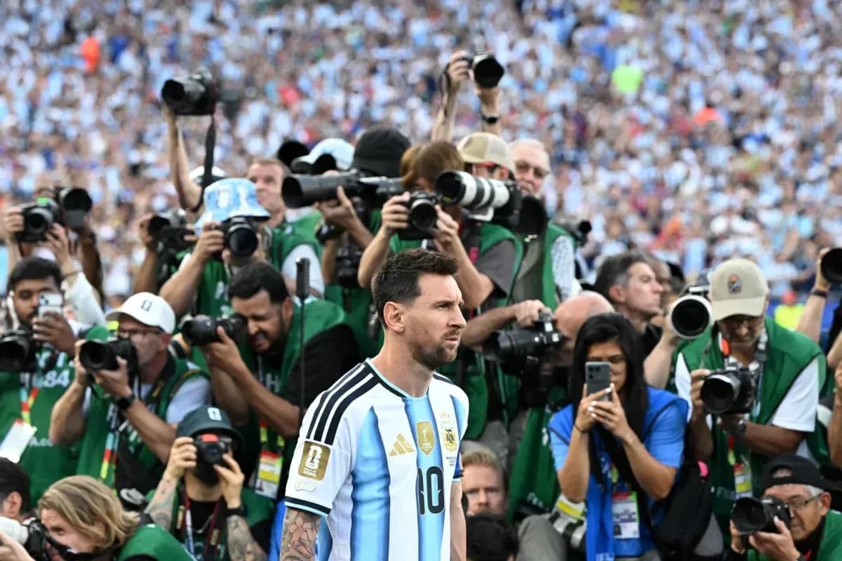Lionel Messi surrounded by photographers at match Lionel Messi surrounded by photographers at match