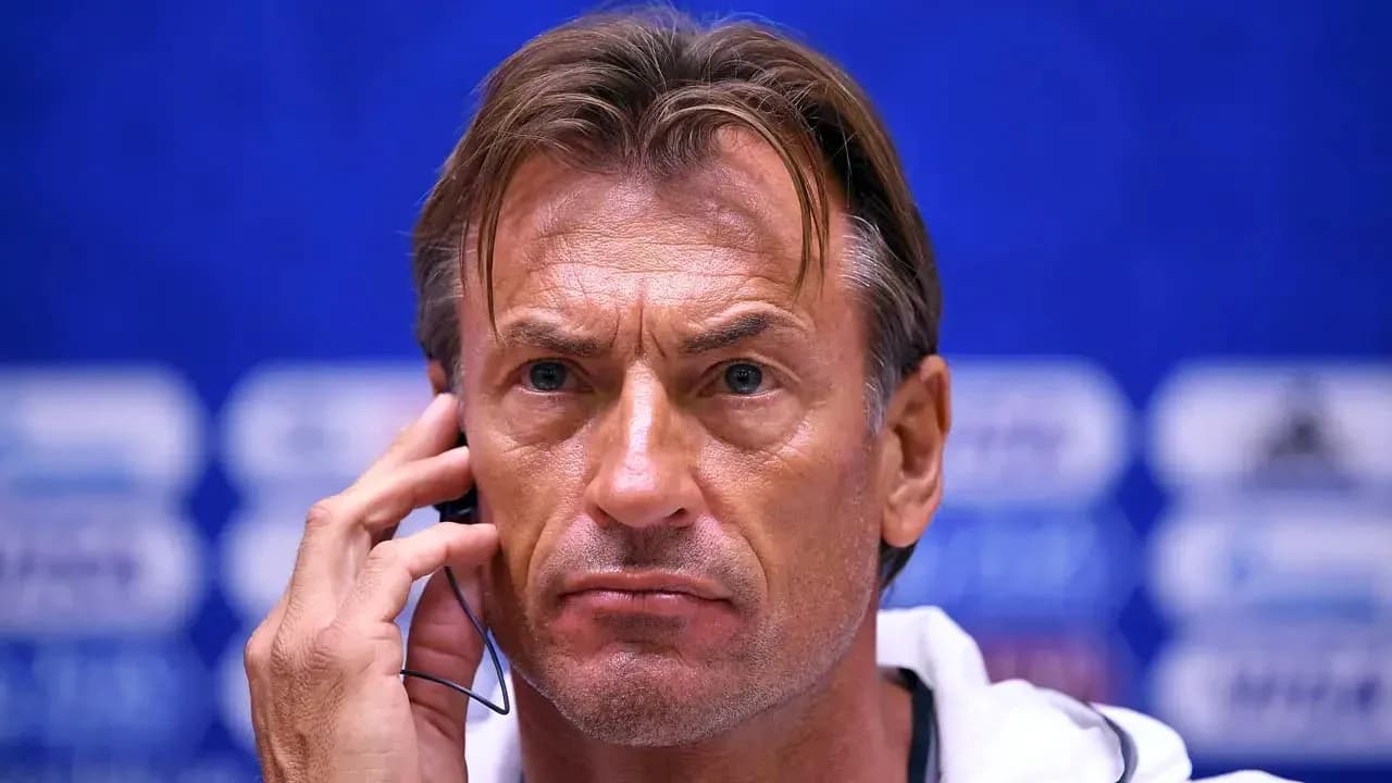 Coach at press conference with headset on Coach at press conference with headset on