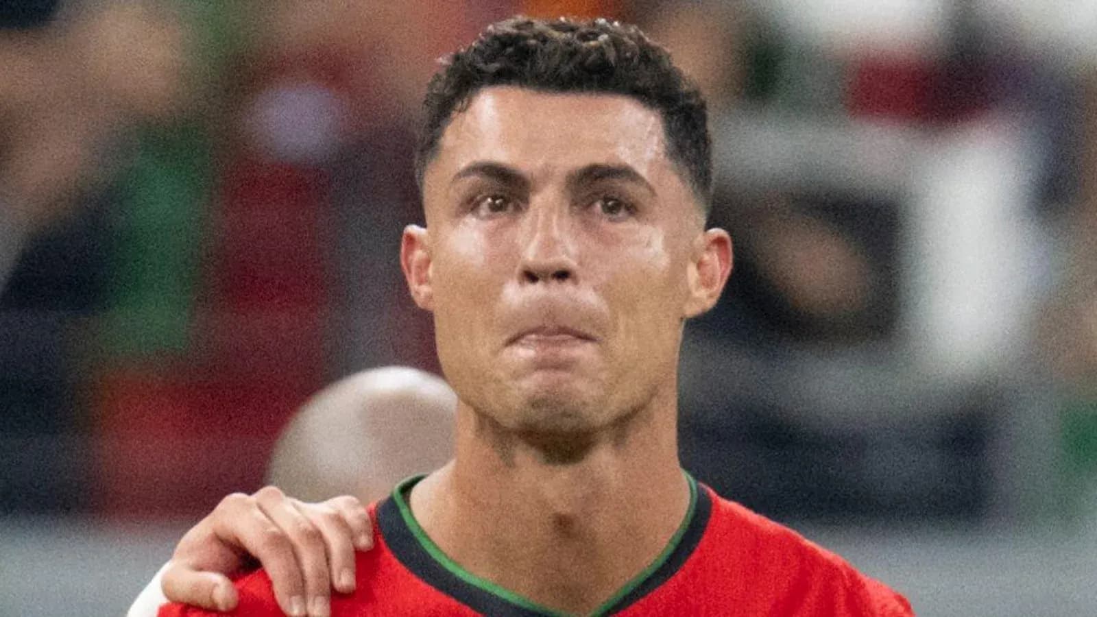 Player in red jersey with emotional expression Player in red jersey with emotional expression