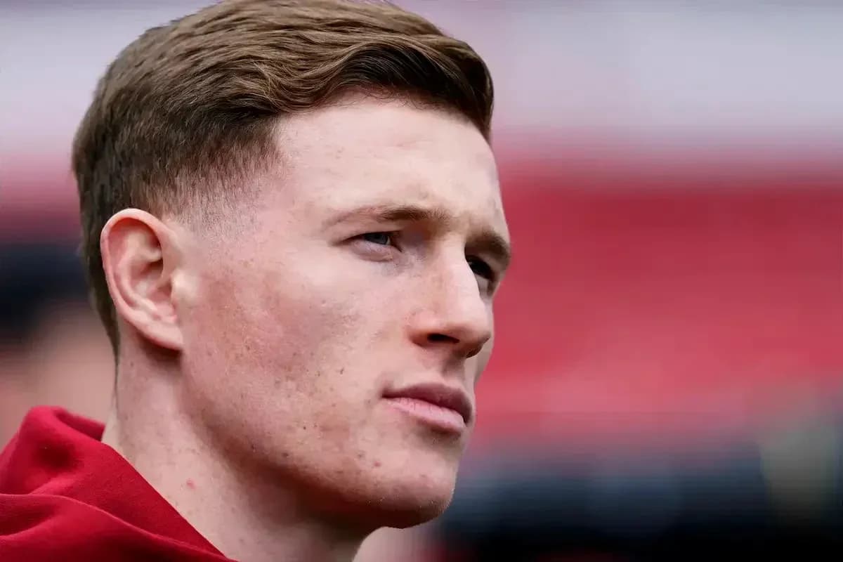 Player with short hair in red training attire Player with short hair in red training attire
