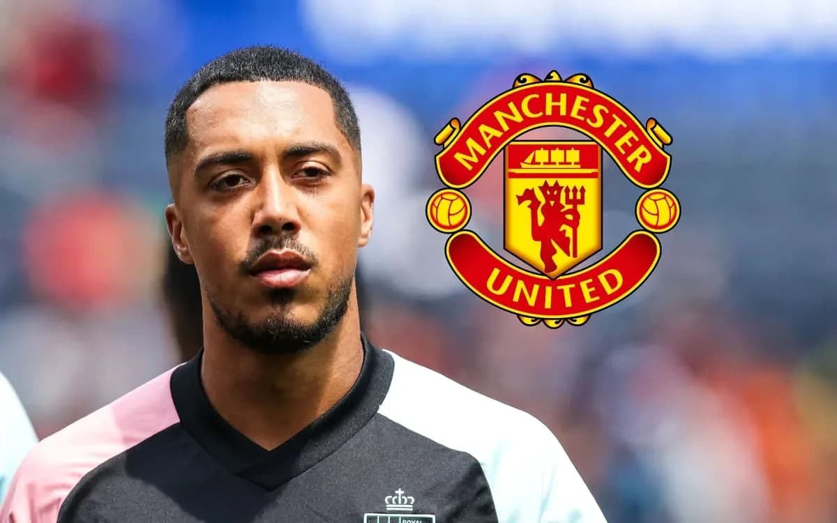 Player in black kit with Manchester United logo Player in black kit with Manchester United logo