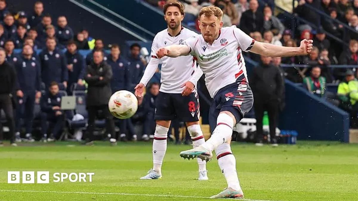 Player taking a shot on goal during match Player taking a shot on goal during match