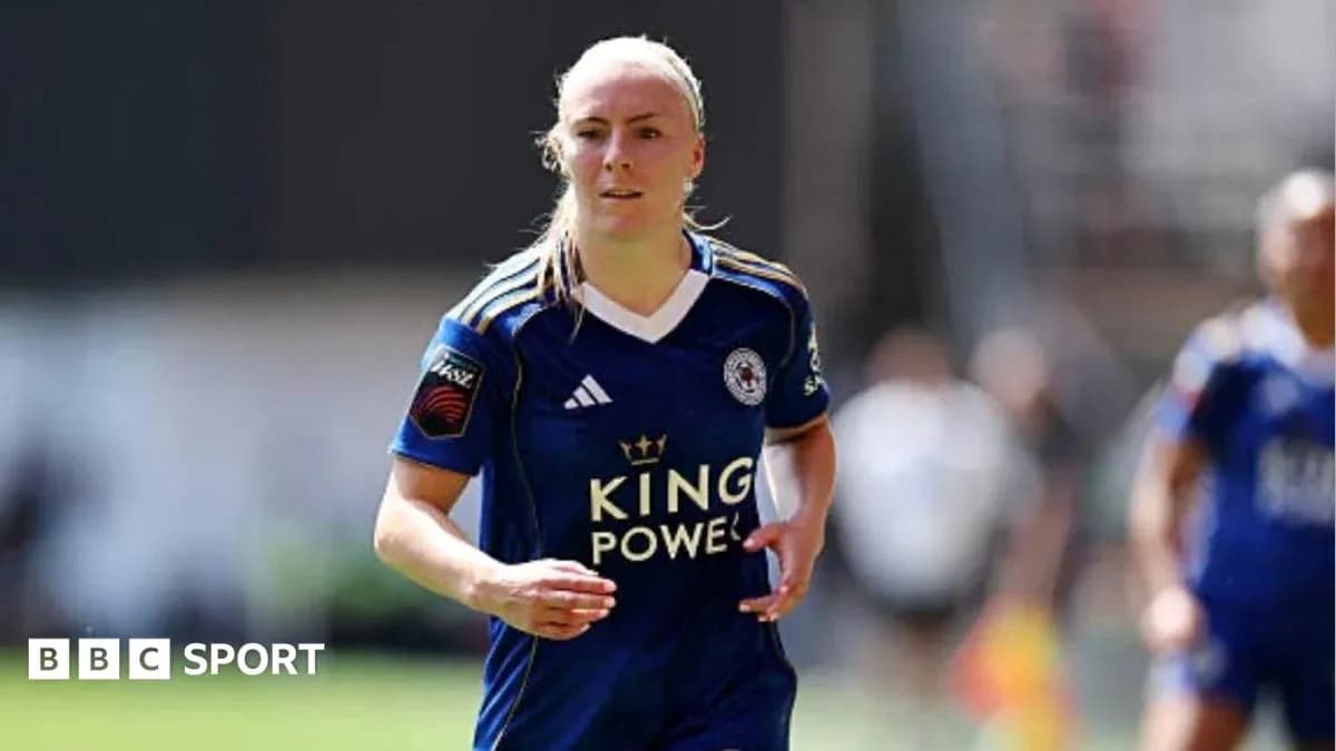 Female player running in Leicester City kit Female player running in Leicester City kit