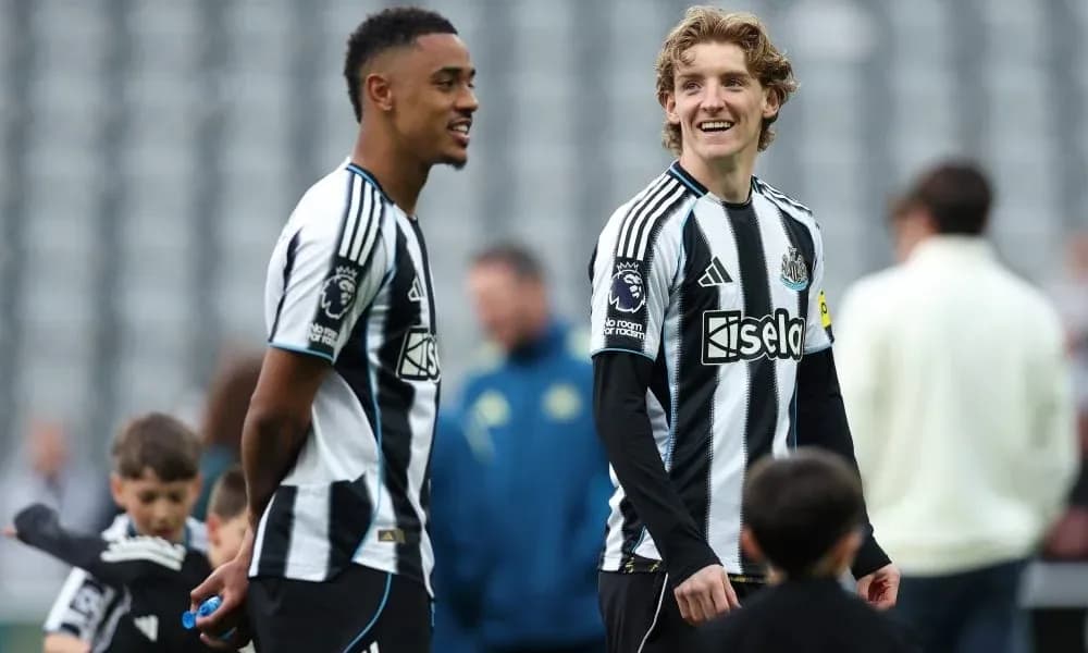 Newcastle players chatting on the pitch before match Newcastle players chatting on the pitch before match