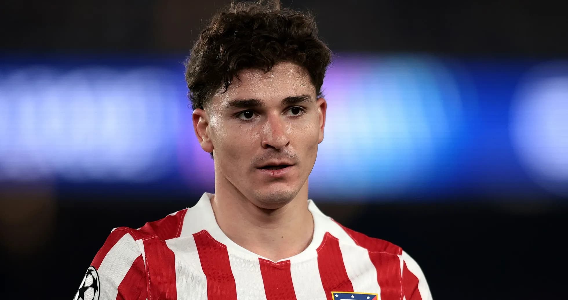 Atletico Madrid player in red and white jersey Atletico Madrid player in red and white jersey