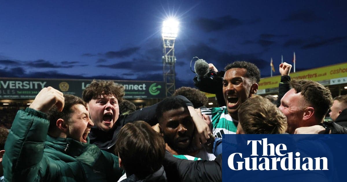 Fans celebrating passionately after a football match Fans celebrating passionately after a football match
