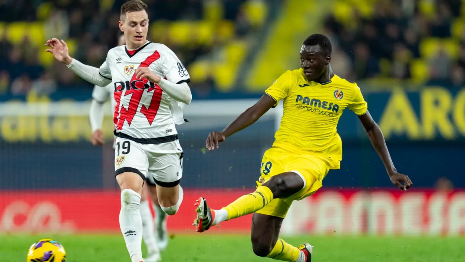 Rayo Vallecano player challenges Villarreal player Rayo Vallecano player challenges Villarreal player