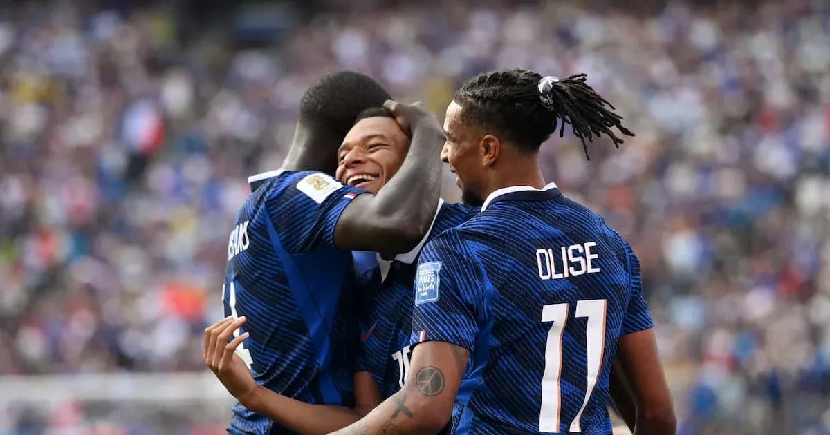 French players celebrating a goal on the field French players celebrating a goal on the field