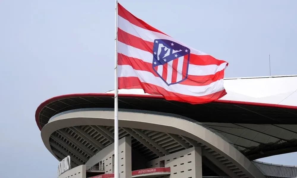 Atletico Madrid flag flying at stadium entrance Atletico Madrid flag flying at stadium entrance